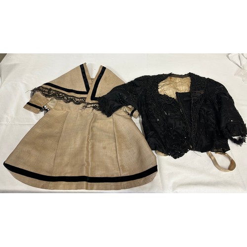 742 - Two Victorian items of clothing to include a child’s dress in brown with black velvet trim, lace sle... 