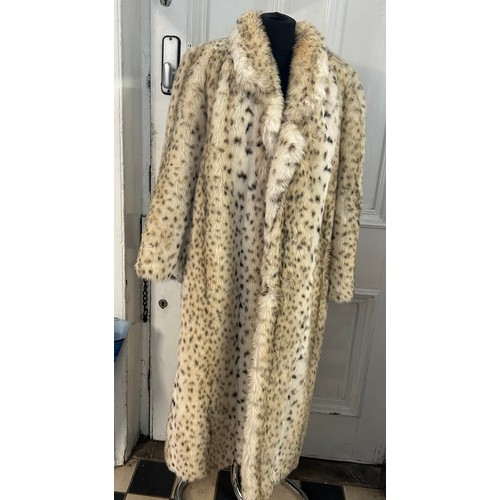 734 - An Astraka of London faux fur leopard skin coat. Approx. 122cm from top of back collar to hem.  Stat... 