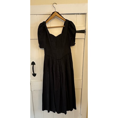 732 - A large quantity of vintage clothing to include a 1980's black cotton Laura Ashley dress, a black ve... 