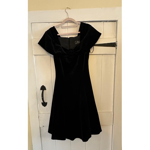 732 - A large quantity of vintage clothing to include a 1980's black cotton Laura Ashley dress, a black ve... 