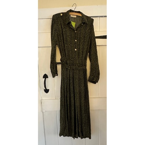 732 - A large quantity of vintage clothing to include a 1980's black cotton Laura Ashley dress, a black ve... 