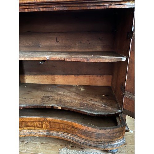 125 - An 18thC Austrian two door inlaid cabinet with sloping top and drawer to base. 109cm w x 94cm h x 48... 