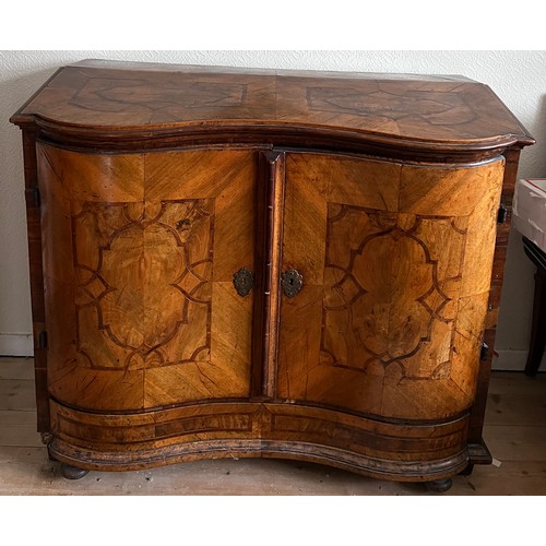 125 - An 18thC Austrian two door inlaid cabinet with sloping top and drawer to base. 109cm w x 94cm h x 48... 