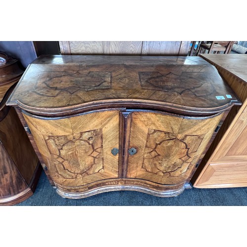 125 - An 18thC Austrian two door inlaid cabinet with sloping top and drawer to base. 109cm w x 94cm h x 48... 