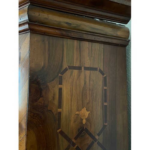 126 - An 18thC Austrian inlaid two door wardrobe on bun feet. Dated 1727 to the top. 202cm h x 57cm d x 17... 