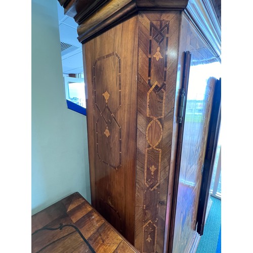 126 - An 18thC Austrian inlaid two door wardrobe on bun feet. Dated 1727 to the top. 202cm h x 57cm d x 17... 