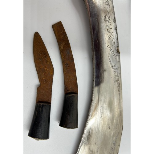 1037 - Kukri with curved 39cm blade engraved India, in leather covered scabbard with two skinning knives.