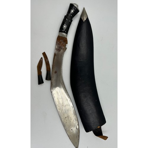 1037 - Kukri with curved 39cm blade engraved India, in leather covered scabbard with two skinning knives.