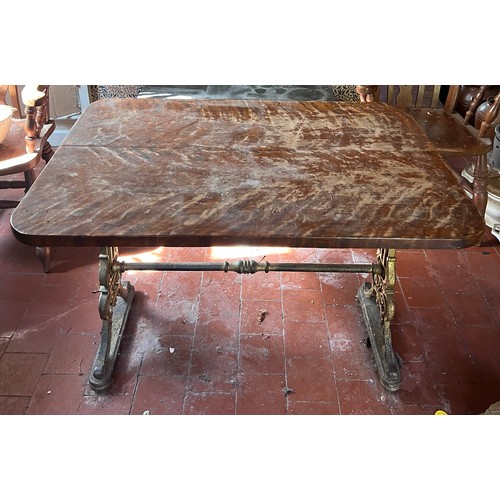 133 - A 19thC pub table with cast iron base. Top 105cm x 72cm 75cm.