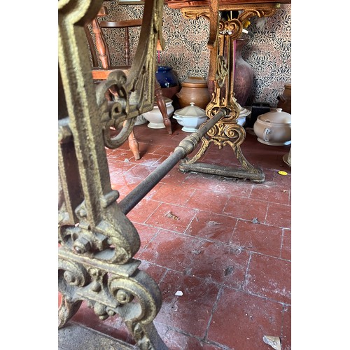 133 - A 19thC pub table with cast iron base. Top 105cm x 72cm 75cm.