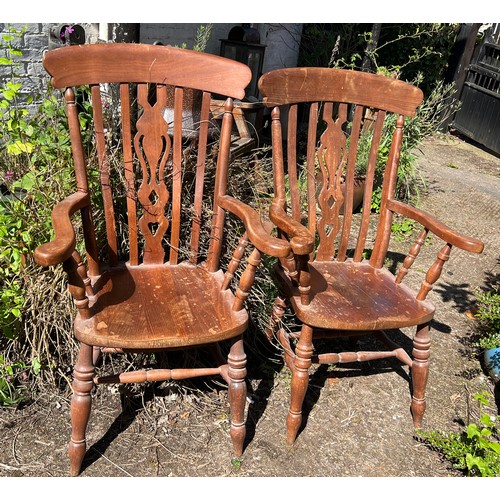 135 - Two 20thC Yorkshire slat back armchairs. Height to back 116cm.