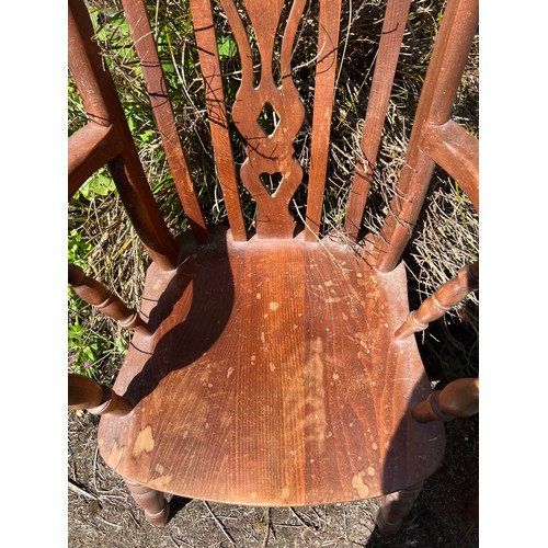 135 - Two 20thC Yorkshire slat back armchairs. Height to back 116cm.