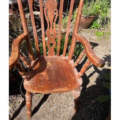 135 - Two 20thC Yorkshire slat back armchairs. Height to back 116cm.