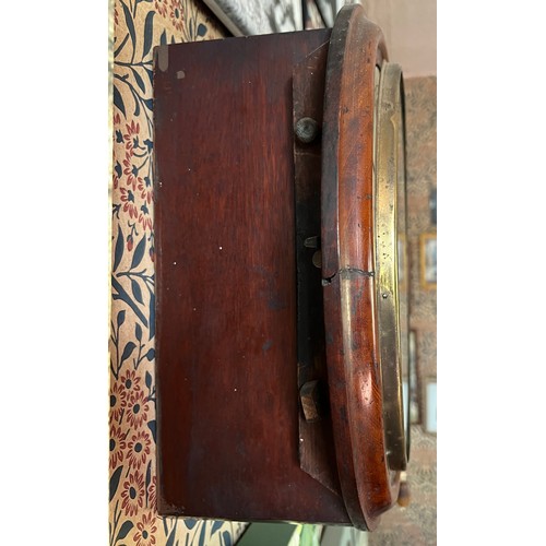 985 - A mahogany framed wall clock marked Barnby and Rust Hull 40cm d.