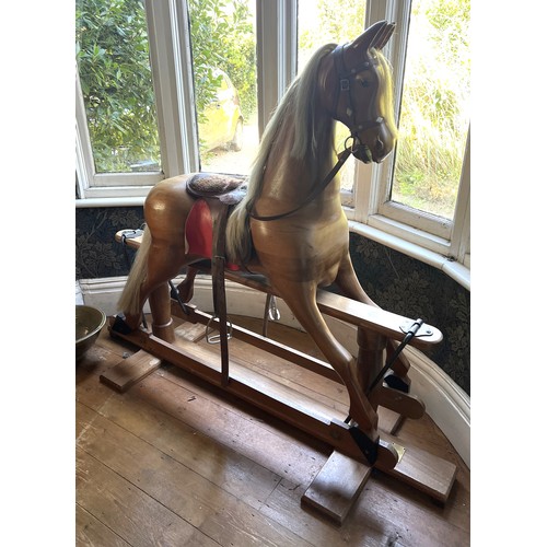 1049 - A good quality wooden rocking horse made by Robert Mullis, with paperwork and original bill from 198... 