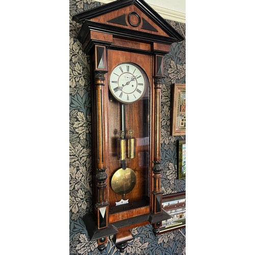 986 - A 19thC double weight Vienna wall clock. 128cm x 41cm.