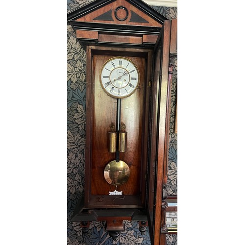 986 - A 19thC double weight Vienna wall clock. 128cm x 41cm.