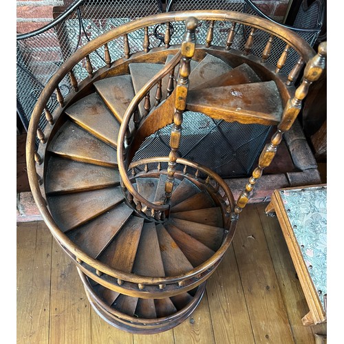 1243 - A miniature spiral staircase with rounded handrail and turned posts. 106cm h.