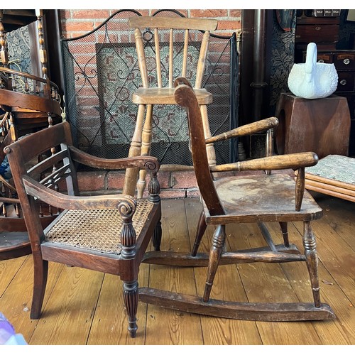 118 - Three vintage children’s chairs to include rocker, cane seated armchair and a high chair, height to ... 