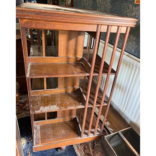 116 - An Edwardian oak revolving bookcase 115cm h x 60cm x 60cm.