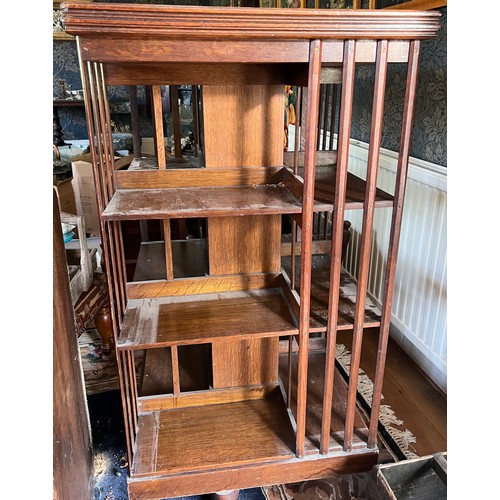 116 - An Edwardian oak revolving bookcase 115cm h x 60cm x 60cm.