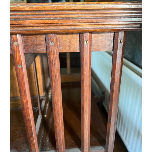 116 - An Edwardian oak revolving bookcase 115cm h x 60cm x 60cm.