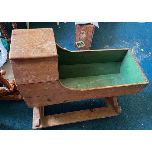 119 - A 19thC pine cradle on rockers on stand. 84cm x 35cm x 75cm.