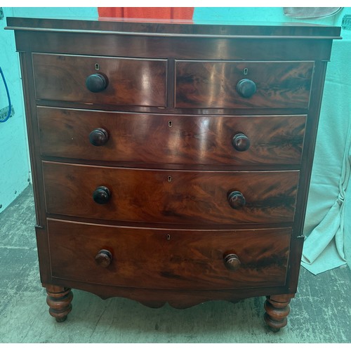 122 - A 19thC bow fronted mahogany chest of two short over three long drawers. 105cm x 66cm x 122cm h.