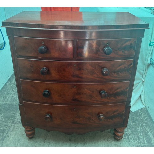 122 - A 19thC bow fronted mahogany chest of two short over three long drawers. 105cm x 66cm x 122cm h.