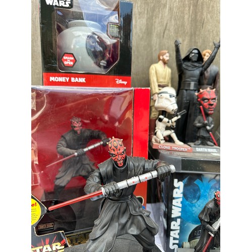 1052 - A quantity of Star Wars toys and collectibles to include a boxed Darth Maul Interactive Talking bank... 