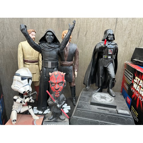 1052 - A quantity of Star Wars toys and collectibles to include a boxed Darth Maul Interactive Talking bank... 