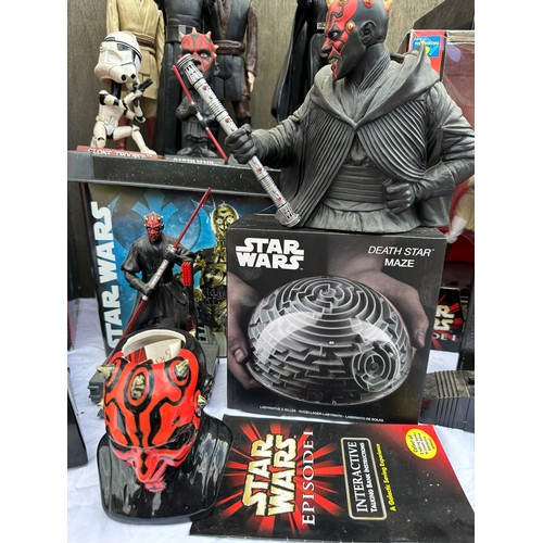 1052 - A quantity of Star Wars toys and collectibles to include a boxed Darth Maul Interactive Talking bank... 