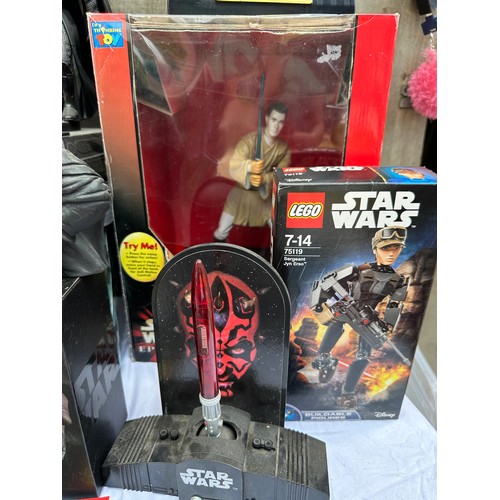 1052 - A quantity of Star Wars toys and collectibles to include a boxed Darth Maul Interactive Talking bank... 