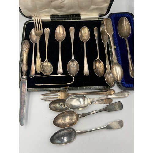 820 - A large quantity of hallmarked silver to include Georgian sugar tongs, spoons etc. Total weight 300g... 