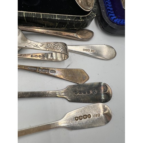 820 - A large quantity of hallmarked silver to include Georgian sugar tongs, spoons etc. Total weight 300g... 