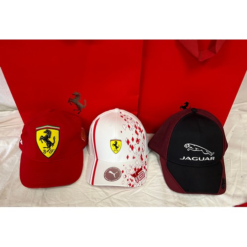 896 - Ferrari interest to include Polo top, 2 x Ferrari caps and a Jaguar together with a Ferrari flag, mo... 