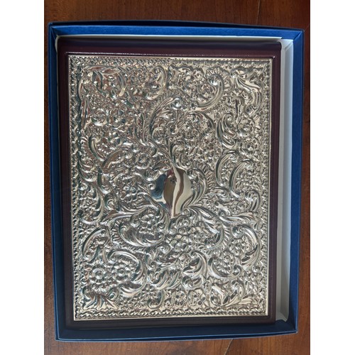 821 - A .925 sterling silver and leather covered address book, unused in original box. 20cm x 15.5cm toget... 