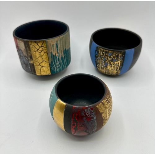 325 - Tony Laverick (born 1961); Three bowls glazed with multi textual qualities, painted TL mark dated 20... 