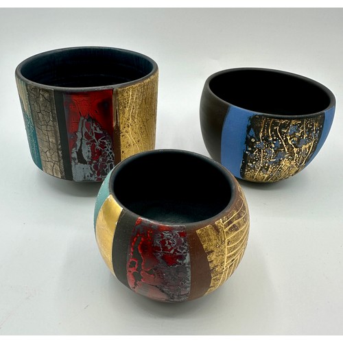 325 - Tony Laverick (born 1961); Three bowls glazed with multi textual qualities, painted TL mark dated 20... 