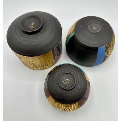 325 - Tony Laverick (born 1961); Three bowls glazed with multi textual qualities, painted TL mark dated 20... 