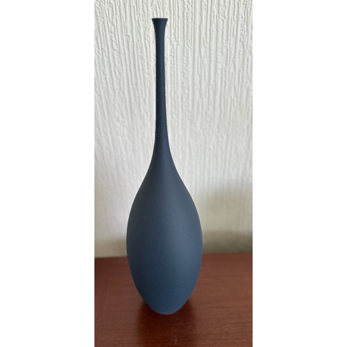 326 - Sophie Cook ; a tall narrow necked porcelain bottle 'Navy Teardrop' covered in blue glaze, impressed... 