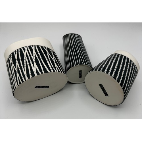 328 - Lara Scobie (b.1967) Three ceramic vases with matt monochrome glazed with coloured interiors. Talles... 