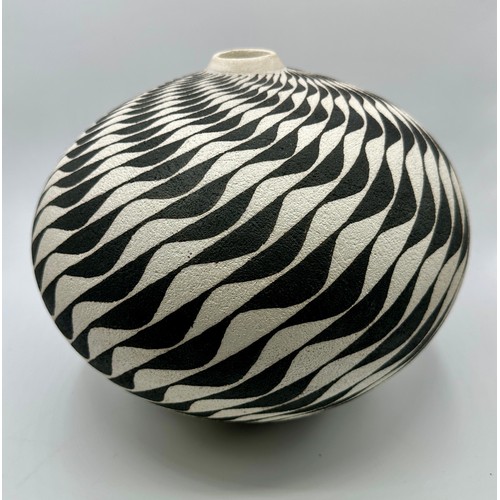 329 - Ilona Sulikova (born 1949); a raku vessel decorated with a wave pattern, height 23cm approx.