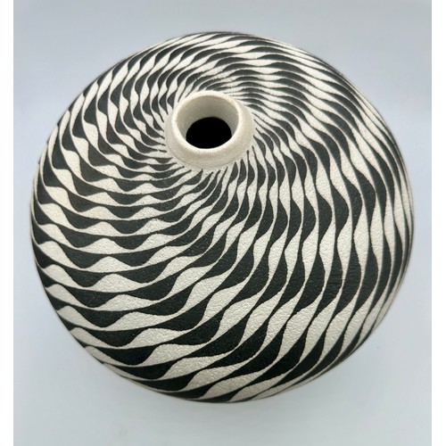 329 - Ilona Sulikova (born 1949); a raku vessel decorated with a wave pattern, height 23cm approx.