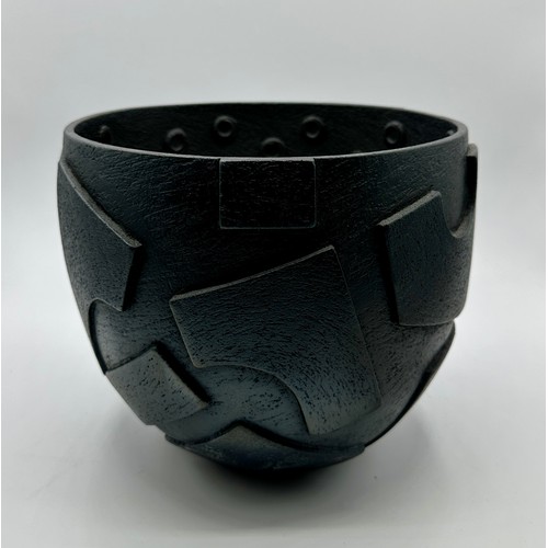 332 - Sue Hanna (born 1963); A burnished circular stoneware bowl with relief armoured surface. The decorat... 