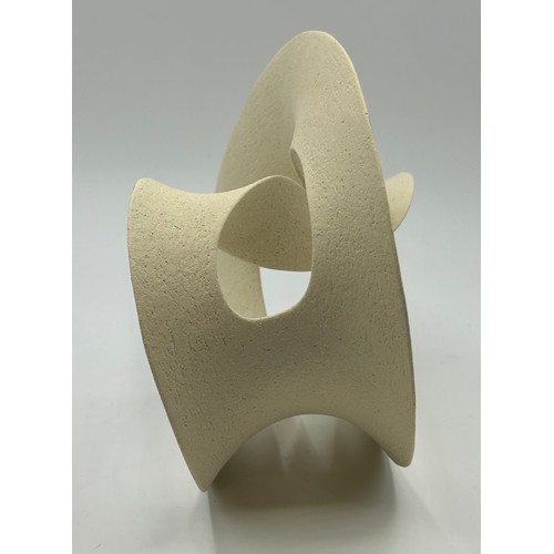 310 - Adrian Bates unglazed stoneware small Mobius sculpture 18cm h.