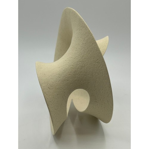 310 - Adrian Bates unglazed stoneware small Mobius sculpture 18cm h.