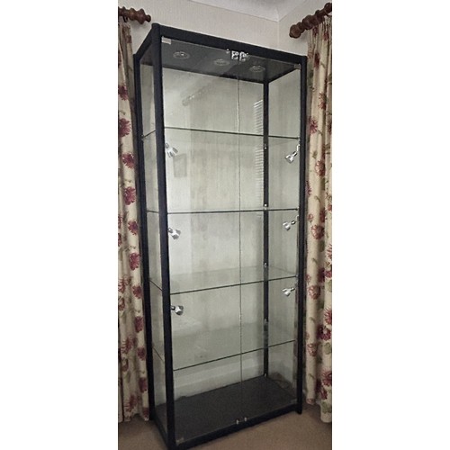 1252 - Three tall black metal display cabinets by Cabinets and Showcases Ltd, each with 4 shelves and light... 