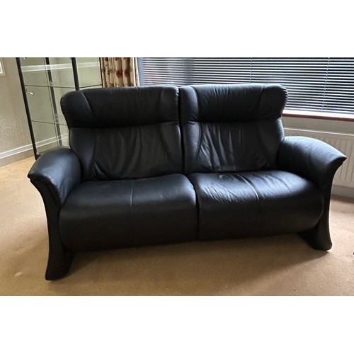 110 - A Himolla black leather two seater settee together with a matching armchair. Settee 164 w x 90 h x 8... 