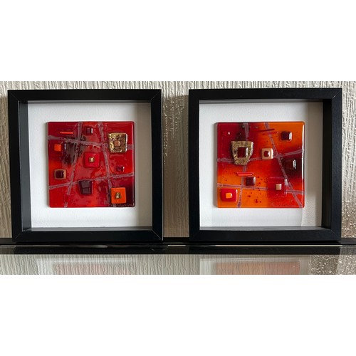 413 - Lisa Villarospo. Two glass wall art in oranges, reds and gold in deep square black frames. 45 x 45cm... 